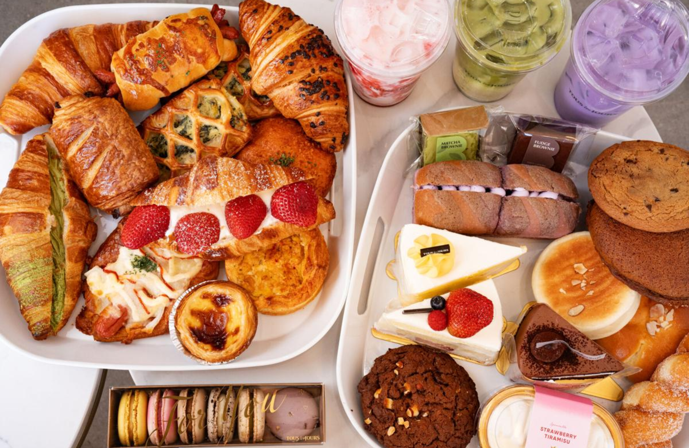 A tempting display of croissants, cookies, cakes, macarons, and refreshing drinks, showcasing the Best Pastries to Try in Iowa A Local’s Guide