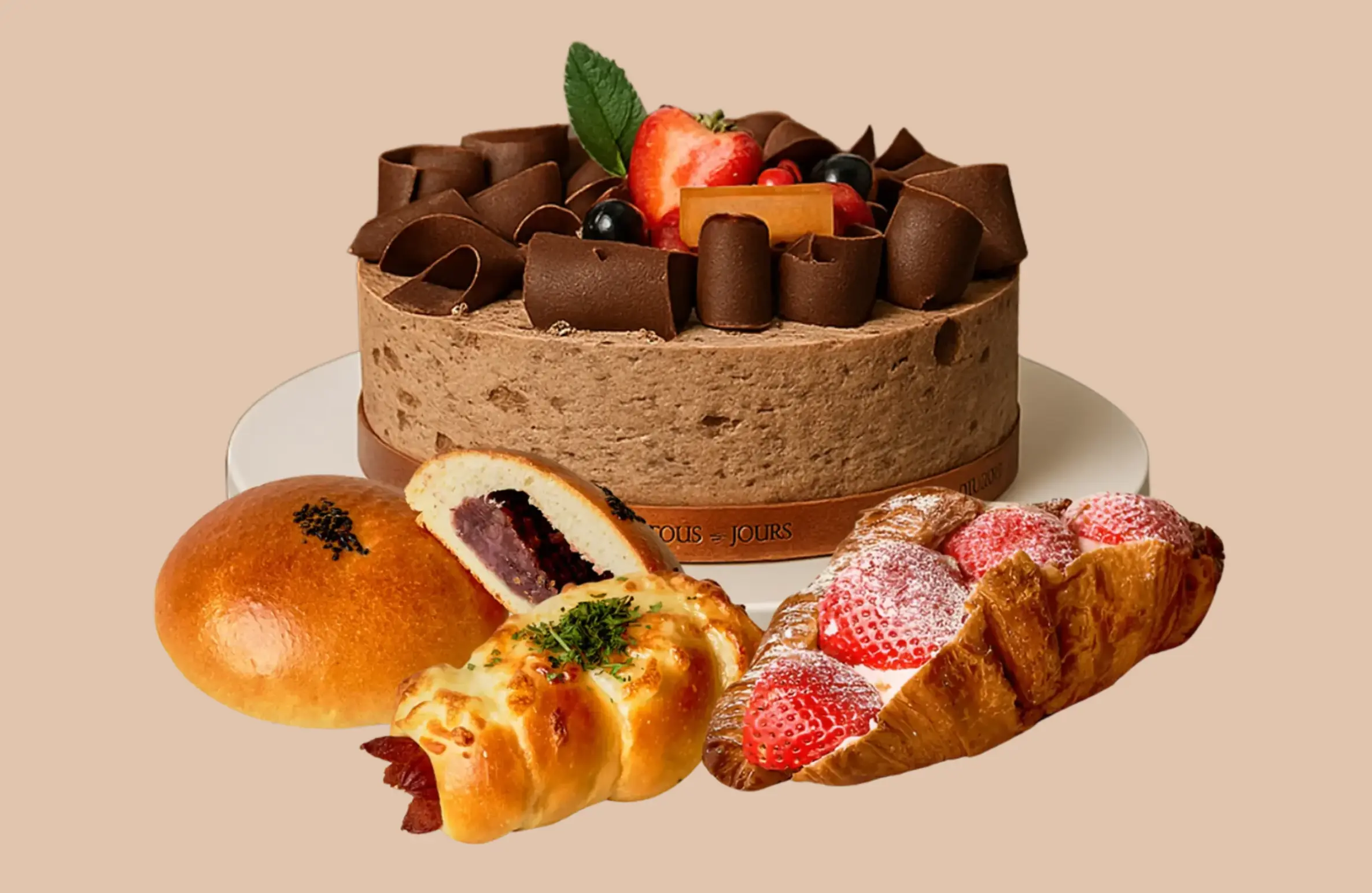 Fresh spring cakes and pastries display at TOUS les JOURS Iowa, featuring colorful seasonal desserts and bakery treats